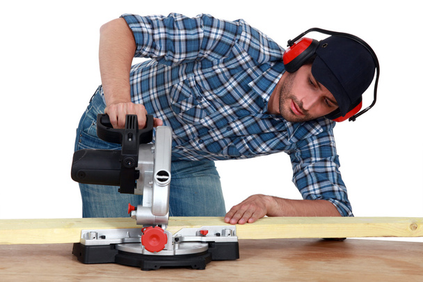 Craftsman testing a new electric saw - Photo, Image