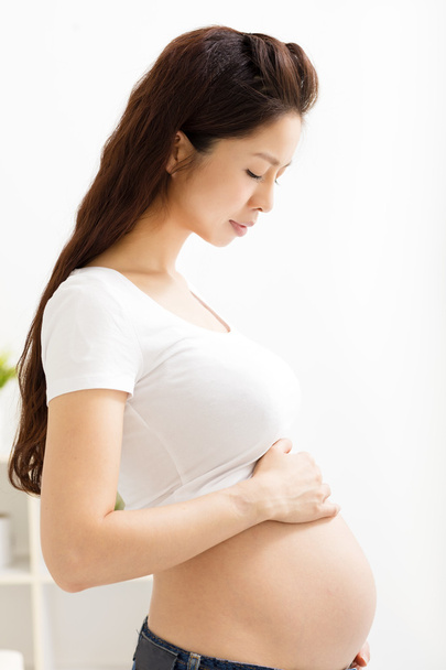 Portrait of the young  smiling pregnant woman - Photo, Image