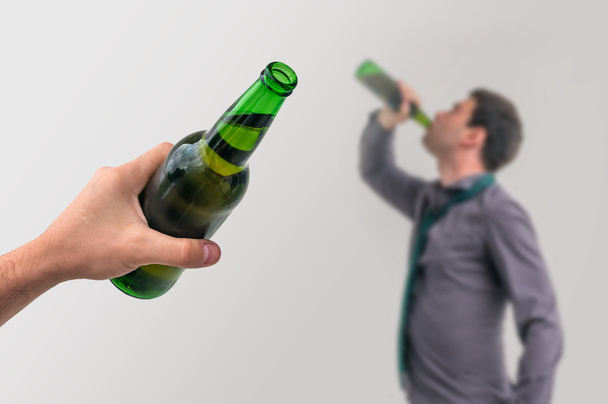 Unfocused man drinking alcohol - Photo, Image