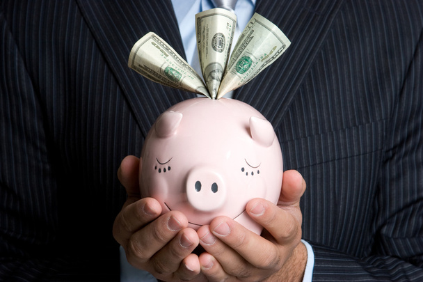 Businessman Holding Piggy Bank - Фото, зображення
