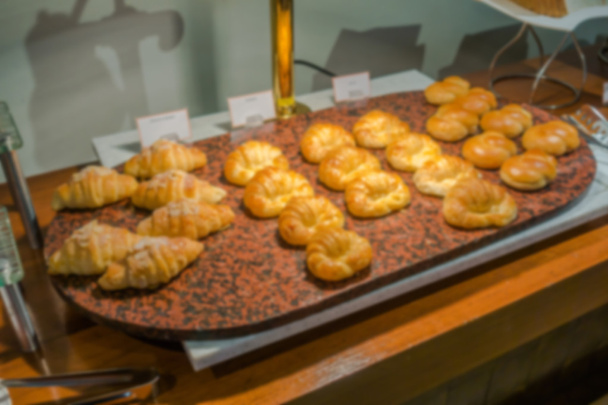 Abstract blur Croissant bread on table in buffet  . - Valokuva, kuva