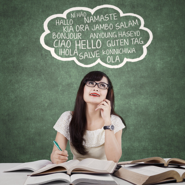Clever female learner studying foreign language - Foto, Bild