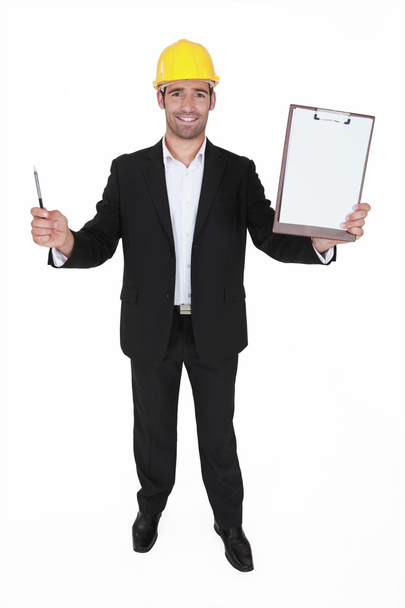 Happy man holding clip-board and pen - Фото, зображення