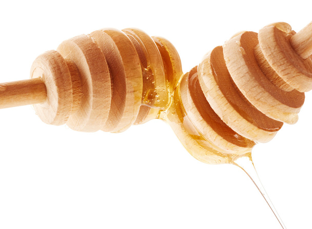 Miel en palos de madera
 - Foto, imagen