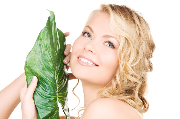 Woman with green leaf - Foto, immagini