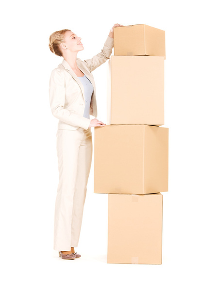 Businesswoman with boxes - Фото, изображение
