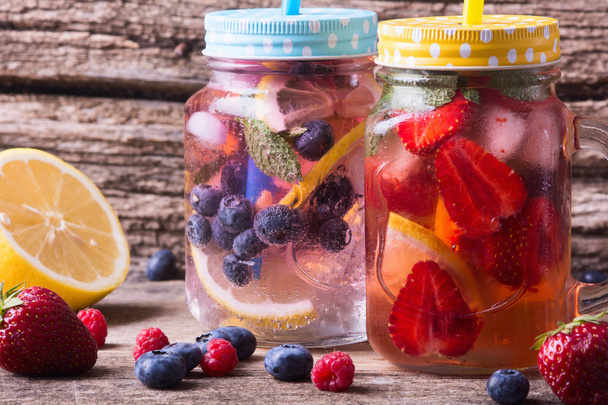 Citrus lemonade with blueberry , strawberry , raspberry - Zdjęcie, obraz
