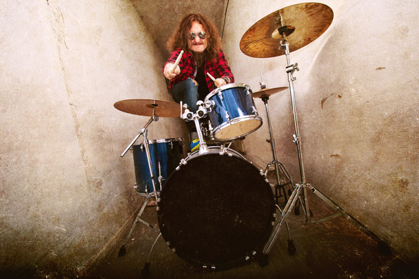 Drums conceptual image. Rock drummer and his drum set. - Фото, изображение