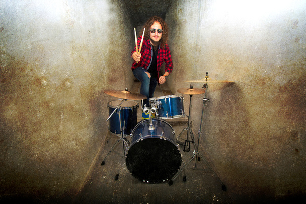Drums conceptual image. Rock drummer and his drum set. - Foto, imagen
