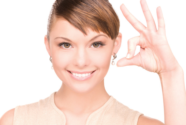 Lovely woman showing ok sign - Foto, immagini