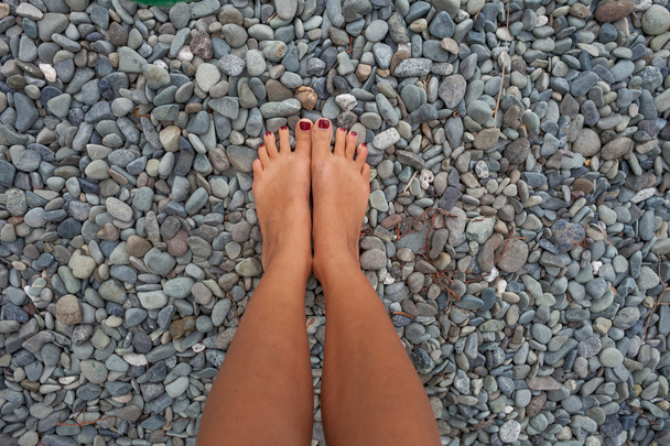 Closeup Photo Legs Young Girl Relaxing Beach.Highly Detailed Image Background.Horizontal picture. - 写真・画像