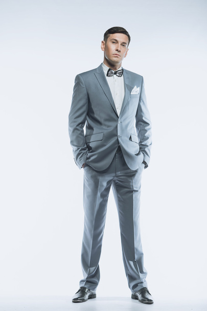 Portrait of a elegant handsome business man on white background - Фото, зображення