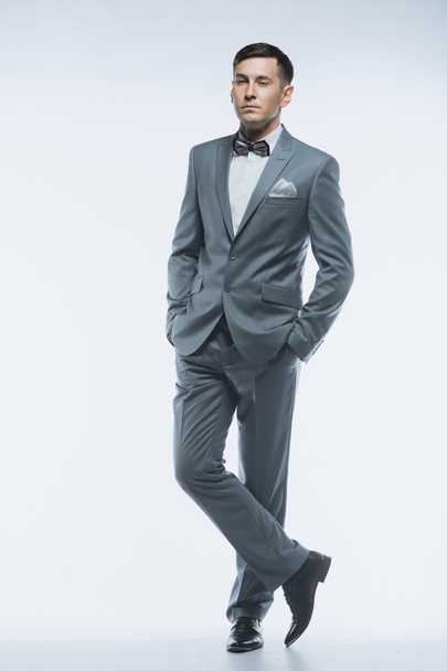 Portrait of a elegant handsome business man on white background - Fotografie, Obrázek