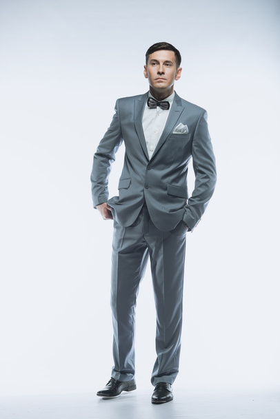 Portrait of a elegant handsome business man on white background - Foto, Imagen