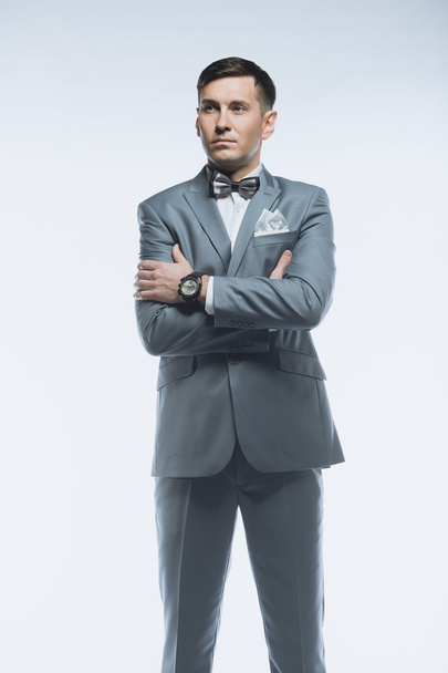 Portrait of a elegant handsome business man on white background - 写真・画像
