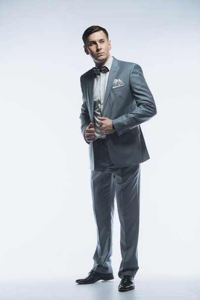 Portrait of a elegant handsome business man on white background - Foto, Bild