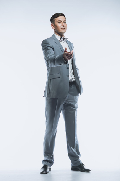 Portrait of a elegant handsome business man on white background - Photo, image