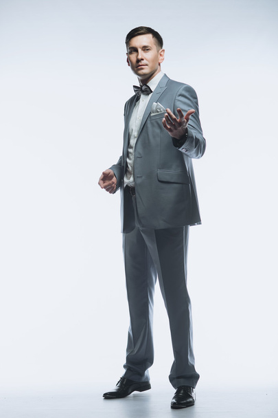 Portrait of a elegant handsome business man on white background - Фото, изображение