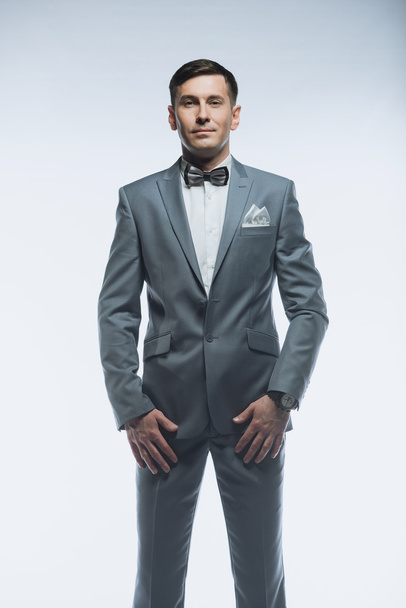 Portrait of a elegant handsome business man on white background - 写真・画像