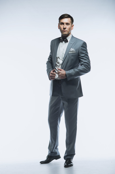 Portrait of a elegant handsome business man on white background - Фото, зображення