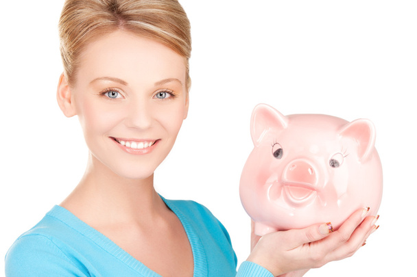 Lovely woman with piggy bank - Foto, Imagen