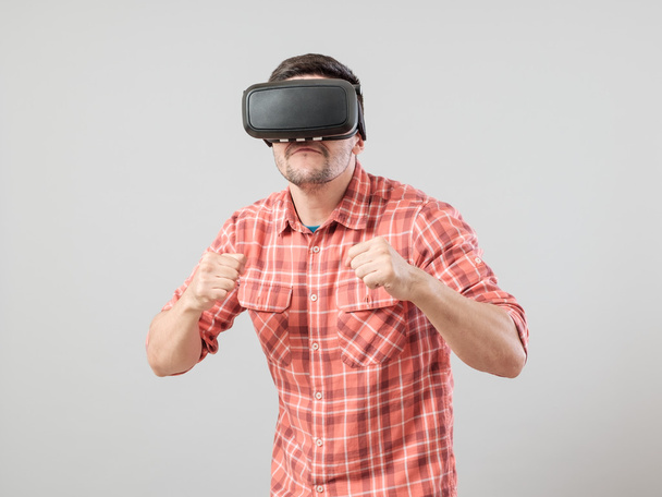Man in fighter stand with virtual reality glasses - Photo, image