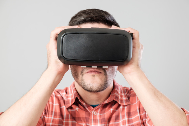 Man using virtual reality headset - Фото, изображение