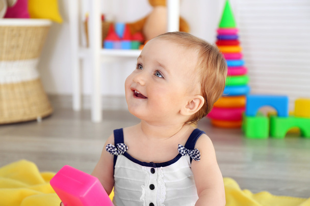 Baby with bright toy blocks  - Фото, зображення