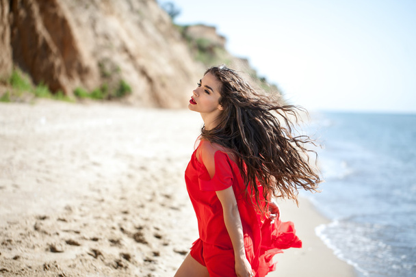 Attractive girl in a smart dress red - Fotografie, Obrázek