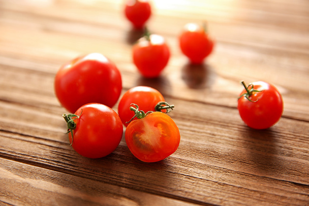 Cherry tomatoes and slice  - Фото, изображение