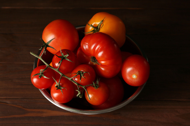 Different tomatoes in metallic bowl  - Foto, Bild