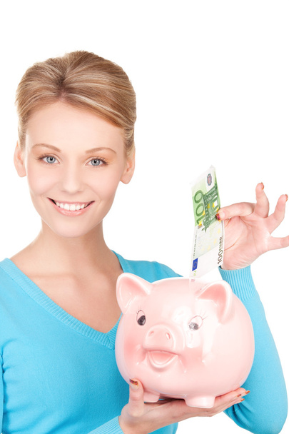 Lovely woman with piggy bank and money - Φωτογραφία, εικόνα