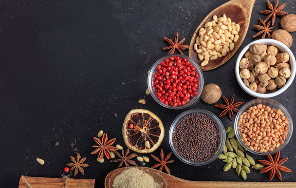 Composition of spices on a black background - Photo, Image
