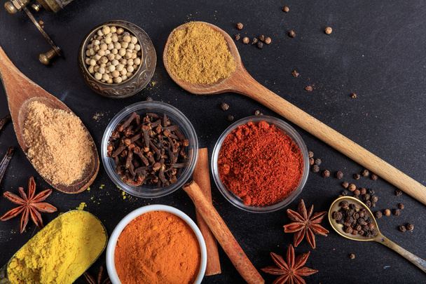 Variety of spices on black background - Photo, Image