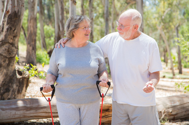 Happy Senior Couple Exercising Outside Together - Photo, Image