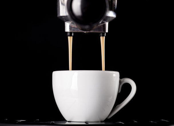 Espresso pouring from coffee machine. - 写真・画像
