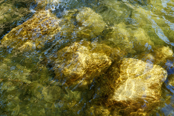 Water en rotsen achtergrond - Foto, afbeelding