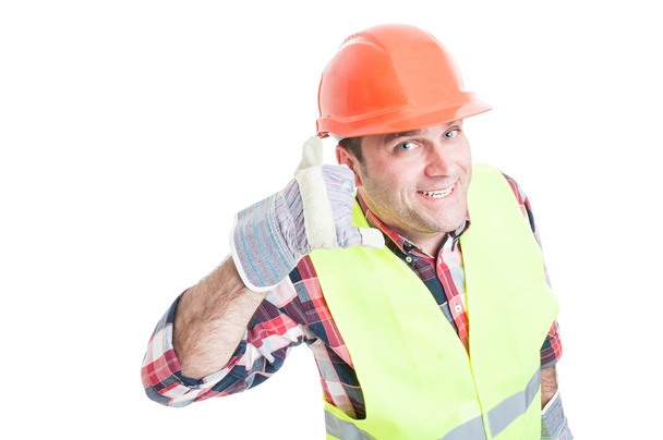 Handsome builder doing a call gesture - Photo, image
