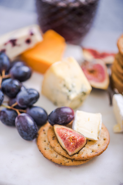 cheese board with grapes,wine,fig and olives - Photo, image