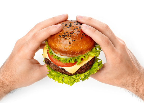 Man holding a burger - Фото, зображення