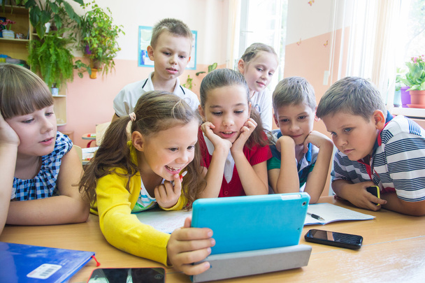 Kids in scholl with tablet - Photo, Image