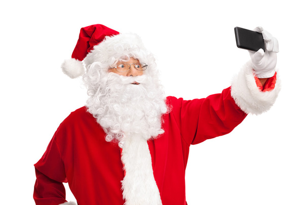 Santa Claus taking a selfie  - Fotografie, Obrázek
