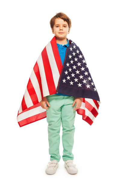 Cute boy wrapped in American flag - Foto, imagen