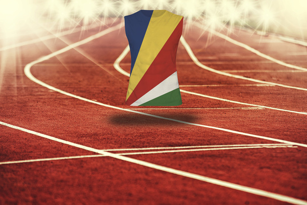 red running track with lines and Seychelles flag on shirt - Foto, immagini