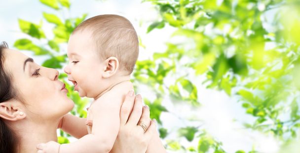 happy mother kissing adorable baby - Fotografie, Obrázek