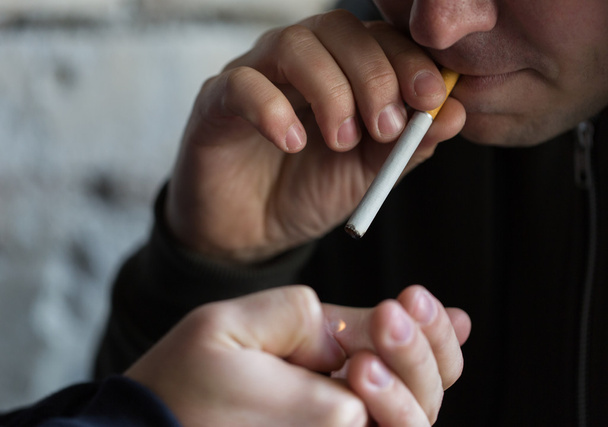 close up of young people smoking cigarette - Fotó, kép