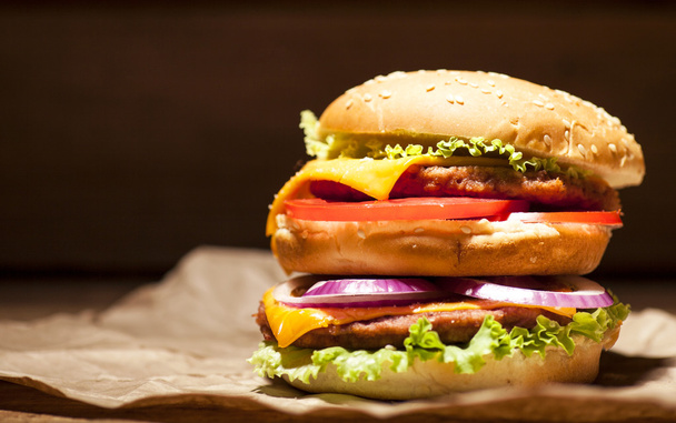 Fresh burger on wooden background - Photo, image