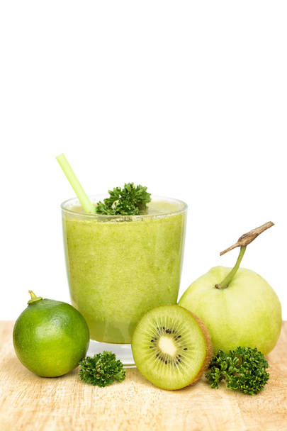 Partly isolated Green healthy drink with ingredients on wood - Foto, immagini
