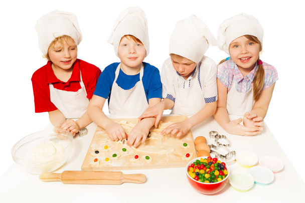 kids in aprons and toques - Фото, изображение