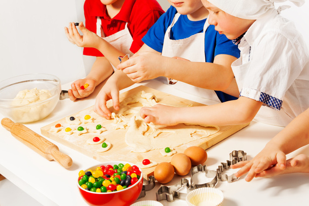 Kids in white aprons making candies - Φωτογραφία, εικόνα